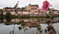 This photo taken on August 14, 2017 shows the Castle of Amboise reflected in the Loire river in Amboise, central France. AFP / Jean-Francois Monier 