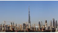 FILE PHOTO: General view of Dubai's cranes at a construction site in Dubai, UAE December 18, 2018. REUTERS/Satish Kumar