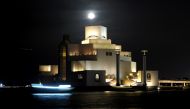 FILE PHOTO: An Arabian dhow sailing pasts the Museum Of Islamic Art (MIA), bathed in the milky-light of full moon in Doha last evening. March, 18 2019. Salim Matramkot/The Peninsula