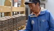 In this file photo taken on March 28, 2018, Nepali mountaineer Kami Rita Sherpa spins prayer wheels at Boudhanath Stupa on the outskirts of Kathmandu. AFP / Prakash Mathema 