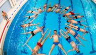 Members of the Stockholm Simkonst Herr (Stockholm Men's Artistic Swimming) synchronised swimming team take part in a training session on May 15, 2019 at a swimming pool in Stockholm. AFP / Jonathan Nackstrand 