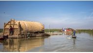 This picture taken on March 29, 2019 shows a floating palm reed-woven house for tourists in the marshes of the southern Iraqi district of Chibayish in Dhi Qar province, about 120 kilometres northwest of the southern city of Basra. AFP / Hussein Faleh
 