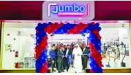 Representatives of Jumbo Electronics cut a ribbon to launch the new showroom at Doha Souq Mall.