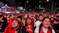 Toronto Raptors fans cheer as they gather to watch Game 4 of the NBA Finals series outside Scotiabank Arena at 'Jurassic Park', on June 7, 2019 in Toronto, Canada. Cole Burston/AFP