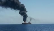 A picture obtained by AFP from Iranian State TV IRIB on June 13, 2019 reportedly shows fire and smoke billowing from a tanker said to have been attacked off the coast of Oman, at an undisclosed location. 