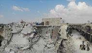 Damaged and destroyed buildings in the town of Ihsim, in Syria’s Idlib region.  AFP / OMAR HAJ KADOUR