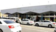 Taxis wait to pick up travellers in front of the arrivals lounge at the Abha airport in the southern Saudi Arabian popular mountain resort of the same name, on June 2, 2019. (AFP)