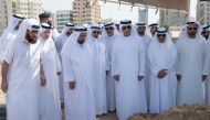 Sheikh Sultan bin Muhammad al-Qasimi (3rd-L), the ruler of the UAE Emirate of Sharjah, attending the burial of his son Khalid, accompanied by the ruler of the Emirate of Ajman Sheikh Humaid bin Rashid Al Nuaimi (4th-L), the ruler of the Emirate of Ras al-