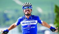 French rider Julian Alaphilippe celebrates his victory as he crosses the finish line of the third stage of the 106th edition of the Tour de France cycling race between Binche and Epernay, in Epernay on July 8, 2019. AFP/Anne-Christine Poujoulat