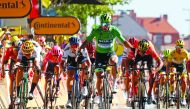 Slovakia's Peter Sagan (R), wearing the best sprinter's green jersey celebrates, past Belgium's Wout van Aert, wearing the best young's white jersey (L), as he wins on the finish line of the fifth stage of the 106th edition of the Tour de France cycling r