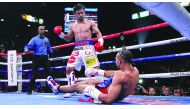 Filipino boxer Manny Pacquiao (L) stands over US boxer Keith Thurman after sending him to the canvas during the first round of their WBA super world welterweight title fight at the MGM Grand Garden Arena on July 20, 2019 in Las Vegas, Nevada.  AFP / John 