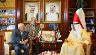 Kuwait's Foreign Minister Sheikh Sabah al-Khaled al-Sabah (R), meeting with Iranian Foreign Minister Mohammad Javad Zarif in Kuwait City. 