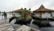 (FILES) This file photo taken on August 6, 2019 shows a view of the resort on an artificial island made with around 700 000 recycled plastic waste collected in the surrounding area, on the Ebrie Lagoon in Abidjan, Ivory Coast. AFP / ISSOUF SANOGO