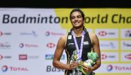 First-placed India's Pusarla Venkata Sindhu poses on with the gold medal during the podium cermony after her victory over Japan's Nozomi Okuhara during their women's singles final match at the BWF Badminton World Championships at the St Jakobshalle in Bas