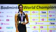 India's Pusarla Sindhu celebrates on the podium with her gold medal after winning the women's singles final at 2019 Badminton World Championships, St. Jakobshalle Basel, Basel, Switzerland, August 25, 2019 Reuters/Vincent Kessler