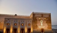 The 2022 Fifa World Cup Qatar logo is projected on the walls of the Oudaya kasbah in the Moroccan capital Rabat on September 3, 2019.  AFP 
