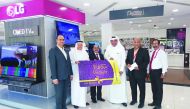 Sajed Jassim Mohammed Sulaiman (third right), Vice-Chairman & Managing Director of Jumbo Electronics, and C V Rappai (third left), Director & CEO, unveil the new ‘Mukafa’  loyalty card in the presence of Abdul Hameed (second left), a long-standing custome