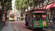 Cable car number thirteen at the Powell Street terminus, San Francisco, with another car in the background cable car system. Photo courtesy: Dllu/Wikimedia Commons/CC BY-SA 4.0