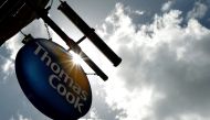 FILE PHOTO: A sign hangs in front of a branch of travel agent Thomas Cook in London May 9, 2011. REUTERS/Luke MacGregor/File Photo