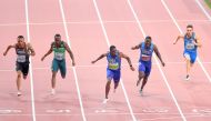 USA’s Christian Coleman (centre) crosses the finish line to win the Men’s 100m final at the 2019 IAAF World Athletics Championships at the Khalifa International stadium in Doha, yesterday. PictureS: Abdul Basit / the Peninsula
