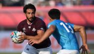 Georgia's centre Giorgi Kveseladze (L) runs with the ball during the Japan 2019 Rugby World Cup Pool D match between Georgia and Uruguay at the Kumagaya Rugby Stadium in Kumagaya on September 29, 2019. / AFP / CHARLY TRIBALLEAU