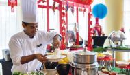 A chef at InterContinental Doha The City during the preparation of a cuisine as it launched a new Friday Brunch at The Square featuring French flavours from around the world