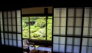 Typical wood sliding doors are seen in room with a garden view at Kakurinbo, a Buddhist temple in Japan's Yamagata Prefecture. Washington Post photo by Natalie Compton.