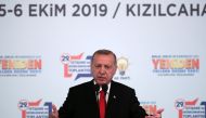 Turkish President Tayyip Erdogan addresses members of his ruling AK Party during a meeting in Ankara, Turkey, October 5, 2019.