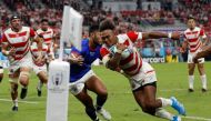 Japan's wing Kotaro Matsushima (R) runs to score a try the Japan 2019 Rugby World Cup Pool A match between Japan and Samoa at the City of Toyota Stadium in Toyota City on October 5, 2019. / AFP / Adrian DENNIS