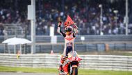 Repsol Honda Team Spanish rider Marc Marquez celebrates on the track after winning the MotoGP race for the Thailand Grand Prix at Buriram International Circuit in Buriram on October 6, 2019. / AFP / Lillian SUWANRUMPHA