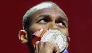 File photo of gold medallist Qatar's Mutaz Essa Barshim poses on the podium during the medal ceremony for the Men's High Jump at the 2019 IAAF Athletics World Championships at the Khalifa International stadium in Doha on October 5, 2019. / AFP / MUSTAFA A