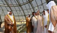 A photo provided by the Kuwaiti news agency KUNA on October 16, 2019 shows the Emir of Kuwait Sheikh Sabah al-Ahmad al-Jaber al-Sabah (R) waving for officials as he arrives at Kuwait international airport. Al-Sabah, returned home today, according to the o