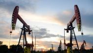 Pumpjacks are seen during sunset at the Daqing oil field in Heilongjiang province, China August 22, 2019. Reuters/Stringer