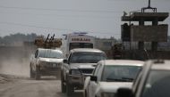 Turkey-backed Syrian rebel fighters return from the Syrian border town of Tal Abyad, as they are pictured on the Turkish-Syrian border in Akcakale, Turkey, October 19, 2019. REUTERS/Stoyan Nenov