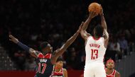 Houston Rockets guard James Harden (13) shots the ball while being fouled by Washington Wizards guard Isaac Bonga (17) in the fourth quarter at Capital One Arena.