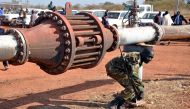 An armed member of the South Sudanese security forces is seen during a ceremony marking the restarting of crude oil pumping at the Unity oilfields in South Sudan, January 21, 2019. Reuters/Samir Bol