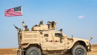 A US armoured vehicle patrols the northern countryside of the northeastern Syrian town of al-Malikiyah (Derik) at the border with Turkey, on November 3, 2019. / AFP / Delil SOULEIMAN