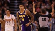 Kyle Kuzma #0 of the Los Angeles Lakers reacts after hitting a three point shot over Cameron Johnson #23 of the Phoenix Suns during the second half of the NBA game at Talking Stick Resort Arena on November 12, 2019 in Phoenix, Arizona. Christian Petersen/