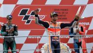 Repsol Honda Team's Spanish rider Marc Marquez celebrates with the trophy on the podium after winning the MotoGP race of the MotoGP Valencia Grand Prix at the Ricardo Tormo racetrack in Cheste near Valencia, on November 17, 2019.   AFP / PIERRE-PHILIPPE M