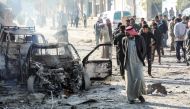 The aftermath of a car bomb explosion at the industrial zone in the northern Syrian town of Tal Abyad, on the border with Turkey.   AFP / Zein Al RIFAI