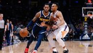 Denver Nuggets guard Monte Morris (11) controls the ball as Phoenix Suns forward Elie Okobo (2) guards in the fourth quarter at the Pepsi Center. Isaiah J. Downing