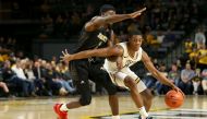 RICHMOND, VA - NOVEMBER 25: KeShawn Curry #11 of the VCU Rams drives against Leon Daniels #1 of the Alabama State Hornets in the second half at Stuart C. Siegel Center on November 25, 2019 in Richmond, Virginia. Ryan M. Kelly/AFP 