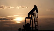  Oil pump jacks work at sunset near Midland, Texas, US, August 21, 2019. Reuters/Jessica Lutz