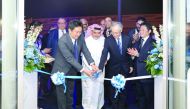 Japanese Ambassador to Qatar, Kazuo Sunaga, cutting the ribbon with Khalid Mannai (centre), Vice-Chairman of the Executive Committee, Mannai Corporation, and Senior Subaru Corporation Executives, to mark the opening of the new Subaru car showroom, recentl