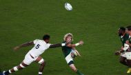 In this file photograph taken on November 2, 2019, South Africa's scrum-half Faf de Klerk kicks the ball past England's lock Courtney Lawes (L) during the Japan 2019 Rugby World Cup final match between England and South Africa at the International Stadium