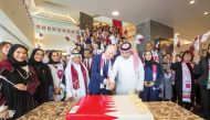 Senior officials of Katara Hospitality cutting cake during an event to celebrate Qatar National Day.