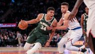 Milwaukee Bucks forward Giannis Antetokounmpo (34) drives the ball to the basket as New York Knicks forward Kevin Knox II (20) defends during the second half at Madison Square Garden.  Vincent Carchietta