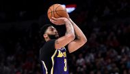 FILE PHOTO: Anthony Davis #3 of the Los Angeles Lakers shoots a free throw during the second half of the game against the Portland Trail Blazers at Moda Center in Portland, Oregon. AFP / Steve DYKES
