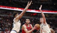 Dec 30, 2019; Chicago, Illinois, USA; Chicago Bulls guard Zach LaVine (8) goes to the basket against Milwaukee Bucks forward Giannis Antetokounmpo (34) and forward Ersan Ilyasova (7) during the second half at United Center. Mandatory Credit: Kamil Krzaczy