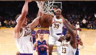 Jan 5, 2020; Los Angeles, California, USA; Los Angeles Lakers center Dwight Howard (39) and forward LeBron James (23) reacts as guard Alex Caruso (4) goes up for a dunk in the second half against the Detroit Pistons at Staples Center. Mandatory Credit: Ja